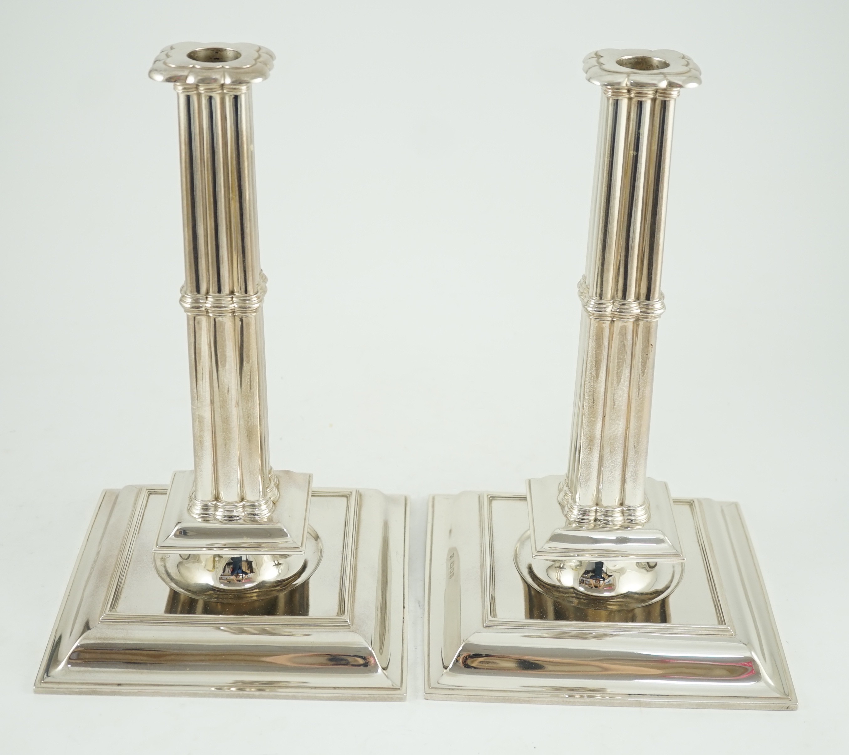 A large pair of George V silver cluster column candlesticks, by William Comyns & Sons Ltd